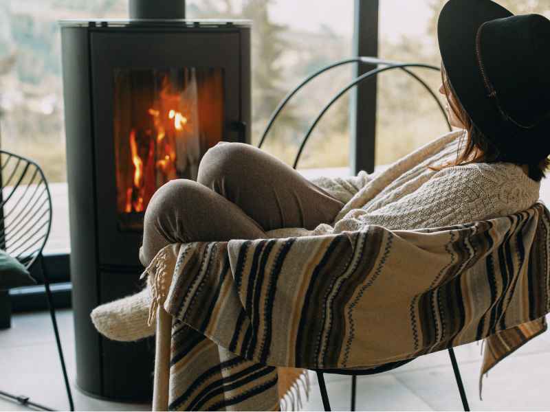 Women by the fire with views over Elbow Valley